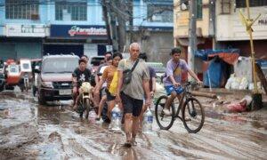Floods in Philippines Kill at Least 9 and Trap Others on Roofs as Storm Approaches